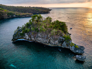 Aerial view of a tropical ocean and bay at sunset (Crystal Bay, Nusa Penida)