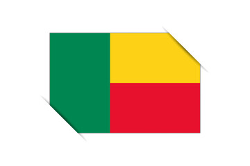 Benin flag - rectangle colorful flag representing a country cultural identity and heritage. The essence of national pride and unity. Attached by the corners in a paper album