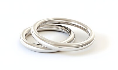 Two simple silver wedding bands intertwined on white background.