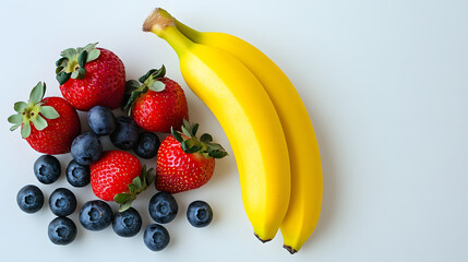 Fresh strawberries, blueberries, and two ripe bananas arranged on a white background.  A vibrant and healthy image perfect for recipes or health-related content.