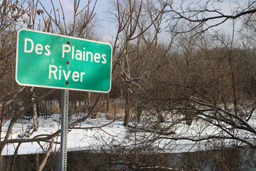 Sign at the Des Plaines River in winter at Algonquin Woods in Des Plaines, Illinois