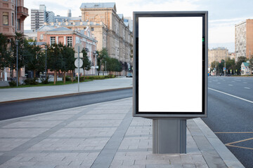 White empty vertical billboard on a clean and tidy street in Moscow. Mock-up.