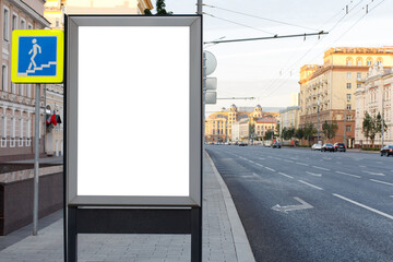 Vertical billboard advertising in the city. Near the underpass at dawn. Mock-up.