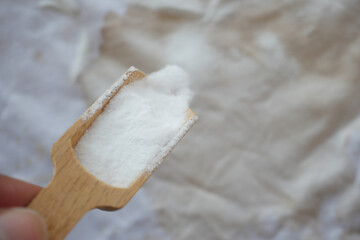 Baking soda on a shirt stain by ink 