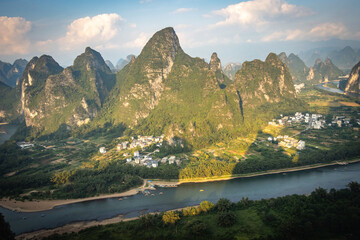 beautiful karst landscape of yangshuo, china, river li, bending river, sunset, hills, view from...