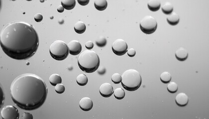 Abstract grayscale image of oil droplets on water.  A mesmerizing mix of light and shadow.