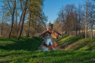 Cross bridge (Krestovy bridge) in the Alexander Park of Tsarskoye Selo on a sunny spring day,...