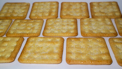 close up square crackers on white background 
