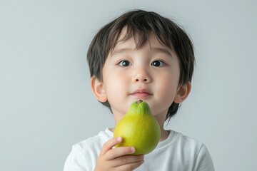 Curious Boy Examining Ripe Guava in Daylight
