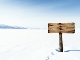 Fototapeta premium Isolated wooden signpost in the middle of a snowy landscape, surrounded by nothing but vast white space