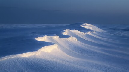 Serene snow drifts under a twilight sky, creating a tranquil winter landscape.