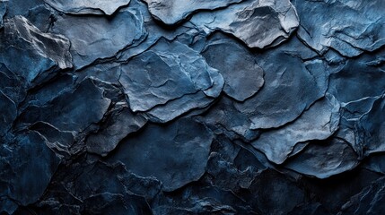 Dark blue slate stone wall texture background.