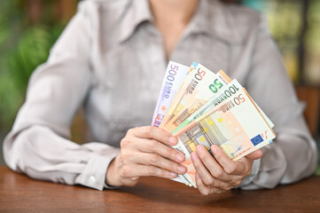 Euro banknotes money on hand. concept of personal loan.,home finance,income,savings.