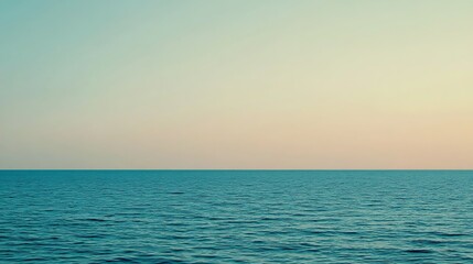 Obraz premium Serene Ocean Meets Calm Sky At Sunset