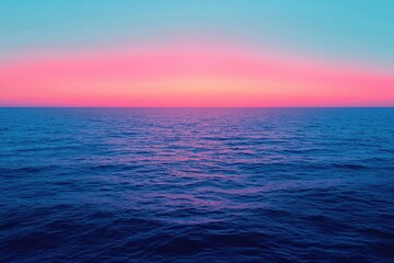 Obraz premium Ocean water surface concept. Vibrant sunset over calm ocean waters with a gradient sky.