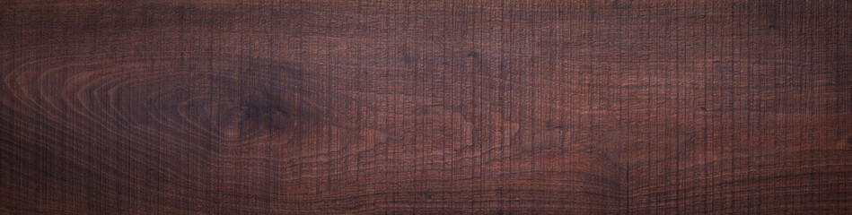 Rough sawn textured walnut wood plank texture background. Old walnut wood plank texture background....