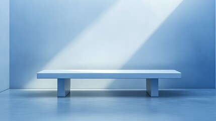 Minimalist table against a smooth blue wall with soft reflections and blurry spotlight, perfect for winter branding of cosmetics, food, or other products.