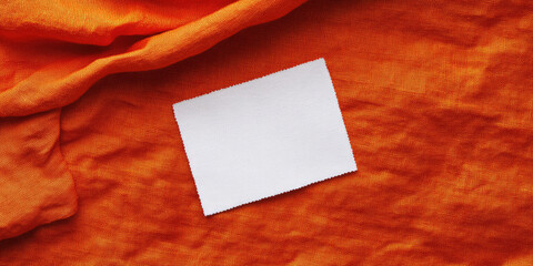 Fototapeta premium Elegant White Laundry Care Label on Fabric for Fashion Projects