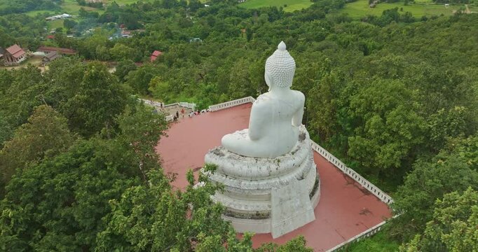 Aerial view Wat Phra That Mae Yen, an ancient temple that has been a symbol of Pai for a long time. Phra Phuttha Lokuttara Mahamuni, a large white Buddha statue in the Mara-Vijaya attitude on hilltop