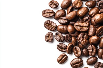 Fototapeta premium A detailed close-up view of a mound of rich, roasted coffee beans resting on a clean white surface, highlighting their texture and color.