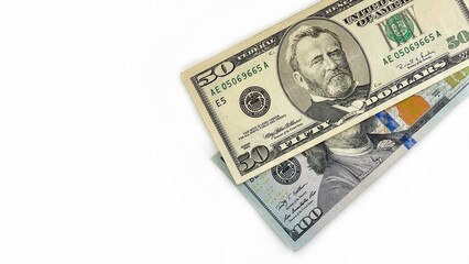 Fototapeta premium Fifty and hundred-dollar bills arranged on a white background, symbolizing financial stability, wealth, investment, and cash flow. Ideal for banking, business, and financial services promotions.