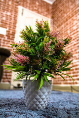 Elegant Plastic Flower Pot with Vibrant Artificial Flowers for Indoor Decoration
