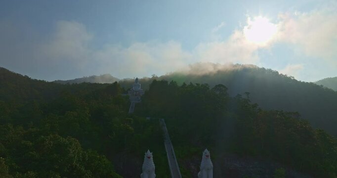 Aerial view Wat Phra That Mae Yen, an ancient temple that has been a symbol of Pai for a long time. Phra Phuttha Lokuttara Mahamuni, a large white Buddha statue in the Mara-Vijaya attitude on hilltop