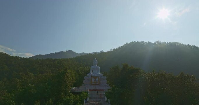 Aerial view Wat Phra That Mae Yen, an ancient temple that has been a symbol of Pai for a long time. Phra Phuttha Lokuttara Mahamuni, a large white Buddha statue in the Mara-Vijaya attitude on hilltop