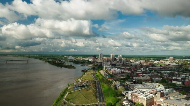 Aerial Panning Scenic View Of City By Bridge Over River On Sunny Day - Memphis, Tennessee