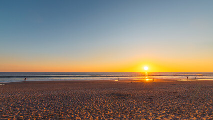
Port Noarlunga beach with people at sunset, South Australia
