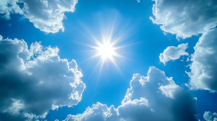 A radiant sunburst piercing a vibrant blue sky surrounded by fluffy white clouds creating a captivating celestial scene