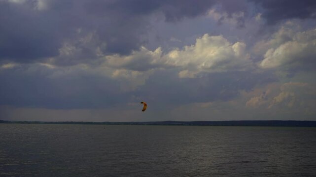 A man kiteboarding in the lake
