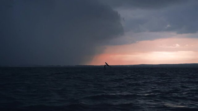 Wingfoil rider riding in the lake