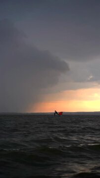 Wing foil rider riding in the lake