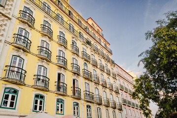 Traditional Yellow Facade with Balconies in Lisbon