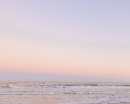 dusk at the beach with pastel skies
