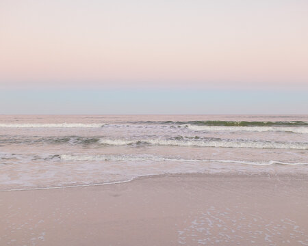 dusk at the beach with pastel skies