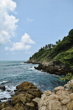 Idyllic blue beach in a beautiful tropical landscape of Oaxaca, Mexico