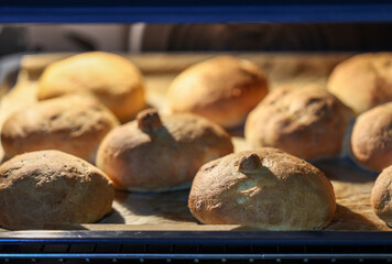 Warm and fresh homemade bread rolls. Food background