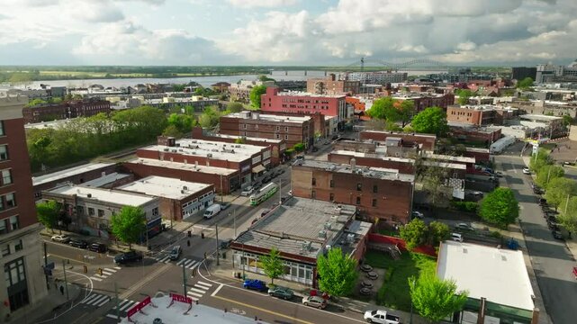 Aerial Forward Shot Of Residential Buildings On City Landscape By River Under Cloudy Sky - Memphis, Tennessee