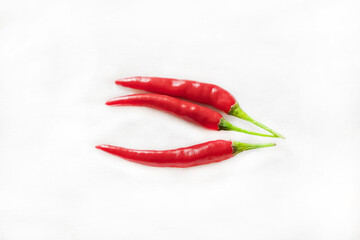 red cayenne pepper pods on white isolated background