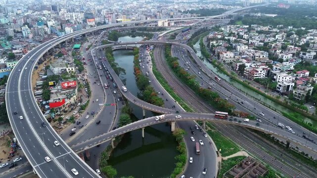 Aerial footage of the traffic on Kuril Flyover Bridge during daytime in Dhaka city, Bangladesh
