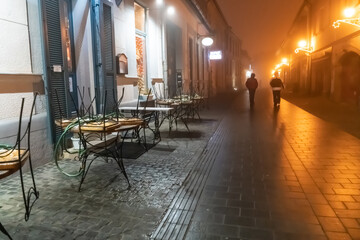 Blurred focus. Foggy alley, street of a European city among historical buildings