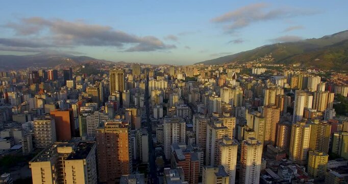 Aerial view of the urban buildings in central of Caracas city, the capital of Venezuela, at sunset