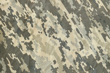 Texture of Dark green pixel camouflage military uniform textile cloth with folds