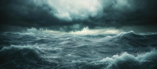 Dramatic stormy ocean waves under dark clouds.