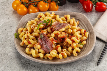 Italian pasta cellentani with anchovy