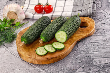 Raw green cucumbers with slices