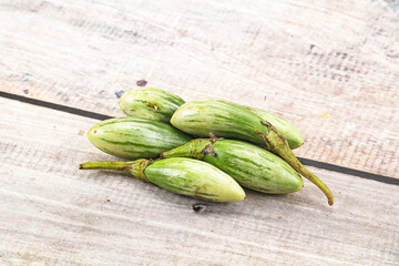 Small organic young green eggplant