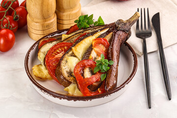 Baked tomato with mozzarella and tomato